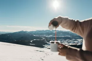 Kayon Mountain pouring a cup of coffee in the mountains